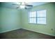 Bedroom showcasing a ceiling fan, large window and new hardwood floors at 4725 Kayworth Rd, Lake Wales, FL 33898