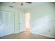 Bedroom featuring a ceiling fan, large closet and new hardwood floors at 4725 Kayworth Rd, Lake Wales, FL 33898