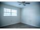 Bedroom showcasing a ceiling fan and a large window at 4725 Kayworth Rd, Lake Wales, FL 33898