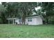 Charming single-story house surrounded by lush greenery at 4725 Kayworth Rd, Lake Wales, FL 33898