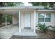 Quaint home displaying a well-kept facade with a covered entrance and ample parking at 4725 Kayworth Rd, Lake Wales, FL 33898