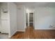 Neutral hallway featuring hardwood floors leading to bedrooms and closets at 4725 Kayworth Rd, Lake Wales, FL 33898
