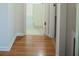 Hallway featuring new hard wood floors leading into the bathroom at 4725 Kayworth Rd, Lake Wales, FL 33898