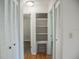 Hallway features a closet, access to other rooms and new hardwood floors at 4725 Kayworth Rd, Lake Wales, FL 33898