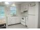 Cozy kitchen with ample cabinet space, appliances and natural light from the sliding doors at 4725 Kayworth Rd, Lake Wales, FL 33898