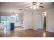 Bright living area with hardwood floors, a ceiling fan, and sliding glass doors leading to the backyard at 4725 Kayworth Rd, Lake Wales, FL 33898