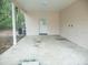 Covered parking area featuring a concrete floor and access to a side door at 4725 Kayworth Rd, Lake Wales, FL 33898