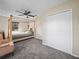 Bedroom with carpet flooring, a ceiling fan, and a double door closet at 509 Mountain Dr, Babson Park, FL 33827