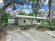 Exterior view of the home with green siding at 509 Mountain Dr, Babson Park, FL 33827