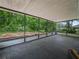 Enclosed patio featuring a concrete floor and a view of the backyard at 509 Mountain Dr, Babson Park, FL 33827