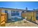 A cozy backyard retreat featuring a table and chairs surrounded by a well-maintained fence and garden at 509 N Scenic Hwy, Frostproof, FL 33843
