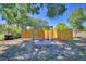Landscaped backyard featuring gravel and paver stones, framed by a sturdy wooden fence and trees at 509 N Scenic Hwy, Frostproof, FL 33843