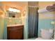 Bathroom with original tiling, a vanity with a marble countertop, and a separate shower stall at 509 N Scenic Hwy, Frostproof, FL 33843