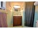 Bathroom with original tiling, a vanity with a marble countertop, and a separate shower stall at 509 N Scenic Hwy, Frostproof, FL 33843