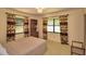 Comfortable bedroom with large windows, natural light and classic decor for a relaxed feel at 509 N Scenic Hwy, Frostproof, FL 33843