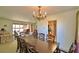 Open-concept dining room with easy access to other living spaces and a view into the kitchen at 509 N Scenic Hwy, Frostproof, FL 33843