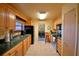 Well-lit kitchen featuring maple cabinets, stainless steel appliances, and a cozy breakfast area at 509 N Scenic Hwy, Frostproof, FL 33843