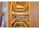Walk-in pantry with wooden shelves and ample storage space at 509 N Scenic Hwy, Frostproof, FL 33843