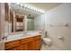 Bathroom featuring a large mirror, vanity with wooden cabinets, and a toilet at 6201 Country Club Dr # 21, Lake Wales, FL 33898