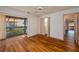 Bedroom with hardwood floors, adjacent balcony, and a walk-in closet at 6201 Country Club Dr # 21, Lake Wales, FL 33898