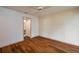 Bright bedroom featuring hardwood floors and access to an ensuite bathroom at 6201 Country Club Dr # 21, Lake Wales, FL 33898