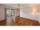 This spacious bedroom features hardwood floors, sliding doors, and bright natural light at 6201 Country Club Dr # 21, Lake Wales, FL 33898