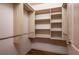 The walk-in closet features custom shelving and ample storage space at 6201 Country Club Dr # 21, Lake Wales, FL 33898