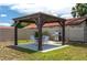 Gazebo with table, chairs, and a grill at 6201 Country Club Dr # 21, Lake Wales, FL 33898