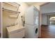 Laundry room with a washer and dryer, utility sink, and wire shelving at 6201 Country Club Dr # 21, Lake Wales, FL 33898