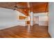 Open-concept living space with wood floors and wood ceiling, connecting to a well-lit kitchen area at 6201 Country Club Dr # 21, Lake Wales, FL 33898