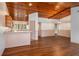 Open living and kitchen area showcasing wood floors, a wood ceiling, and a breakfast bar at 6201 Country Club Dr # 21, Lake Wales, FL 33898