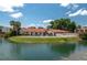 Community pool by the water; blue skies overhead, with beautiful architecture at 6201 Country Club Dr # 21, Lake Wales, FL 33898