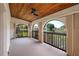The sunroom features views of the beautiful landscape, a ceiling fan, and plenty of windows at 6201 Country Club Dr # 21, Lake Wales, FL 33898