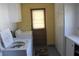 Laundry room with white cabinets, washer, and dryer at 7 Lamplight Ln, Winter Haven, FL 33884