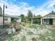 Image of a backyard featuring an unfinished garage, tools and other items at 715 S Seminole Ave, Fort Meade, FL 33841
