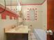 This small bathroom features a marble countertop and pink accent tiles at 715 S Seminole Ave, Fort Meade, FL 33841