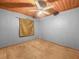 This bedroom features carpet, grey walls, and a wood plank ceiling at 715 S Seminole Ave, Fort Meade, FL 33841