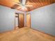 This bedroom features carpet, grey walls, a closet and wood ceiling at 715 S Seminole Ave, Fort Meade, FL 33841