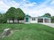 Charming single-story home with well-maintained lawn and mature tree in a desirable neighborhood at 715 S Seminole Ave, Fort Meade, FL 33841