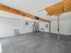 Spacious garage with concrete floor, high ceilings and utility hookups at 715 S Seminole Ave, Fort Meade, FL 33841