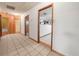 Spacious hallway featuring tile floors and wood-trimmed doorways to other rooms at 715 S Seminole Ave, Fort Meade, FL 33841