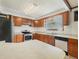 Well-lit kitchen with stainless steel appliances, lots of cabinet space, and a double sink at 715 S Seminole Ave, Fort Meade, FL 33841