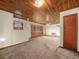 Living room boasting wood ceiling, carpeted flooring and large window with natural light at 715 S Seminole Ave, Fort Meade, FL 33841