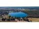 Lakefront home nestled among mature trees with views of a pristine lake and an adjacent tree farm at 7254 Wisteria Ln, Lake Wales, FL 33898