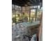 Inviting screened patio with outdoor seating and views of the surrounding landscape at 7254 Wisteria Ln, Lake Wales, FL 33898