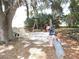Backyard playground with swings, slide, and play area, perfect for outdoor activities at 7254 Wisteria Ln, Lake Wales, FL 33898