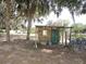 Charming outdoor shed with decorative details and functional design near the lake at 7254 Wisteria Ln, Lake Wales, FL 33898
