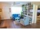 Cozy sitting room with blue sofa, striped chair and shelving at 7254 Wisteria Ln, Lake Wales, FL 33898