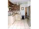 Spacious kitchen featuring stainless steel appliances, ample storage, and tiled flooring at 7591 Limonia Dr, Indian Lake Estates, FL 33855