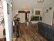 Inviting living room with hardwood floors and a cozy fireplace at 7591 Limonia Dr, Indian Lake Estates, FL 33855